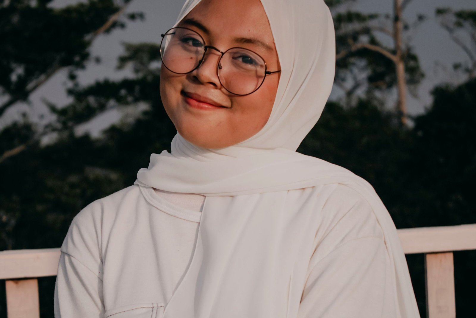 Smiling woman in a hijab at a festive gathering